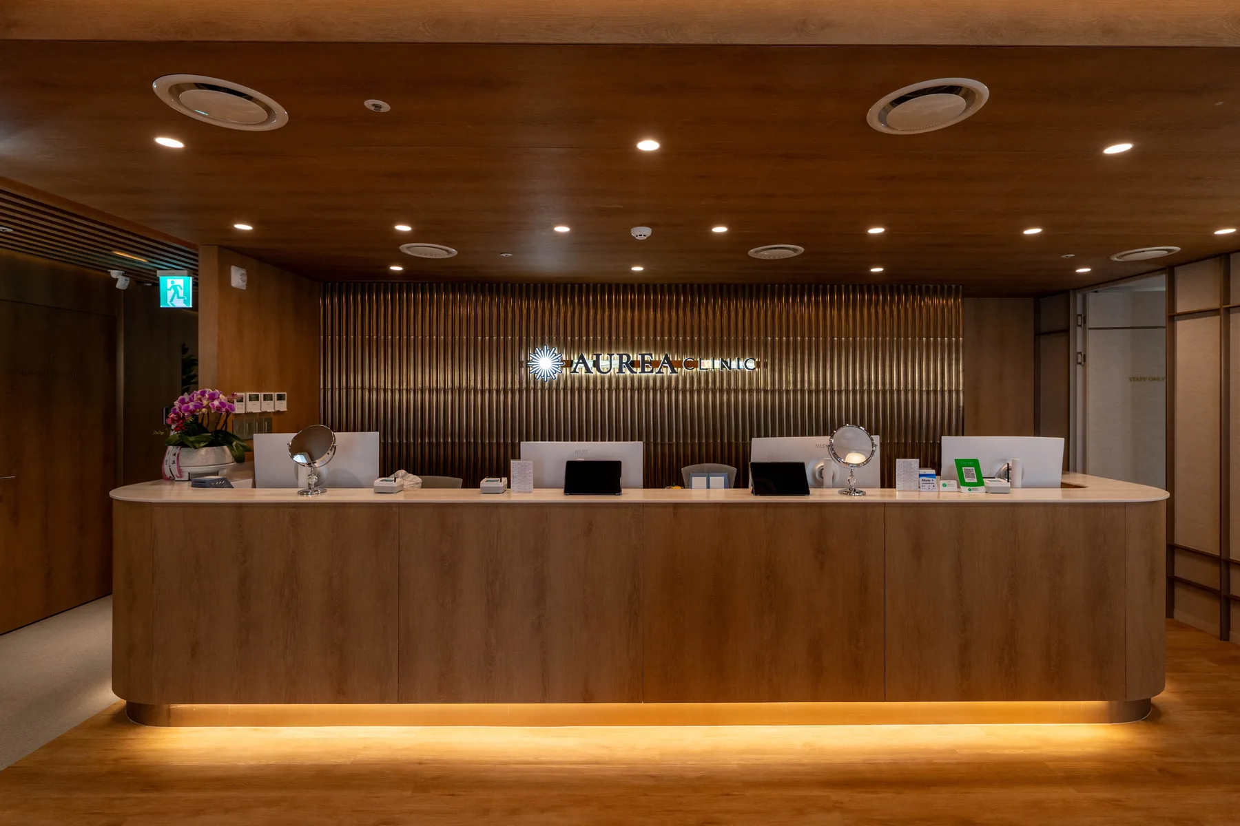 Aurea Clinic reception desk and illuminated clinic sign in Myeongdong, Seoul